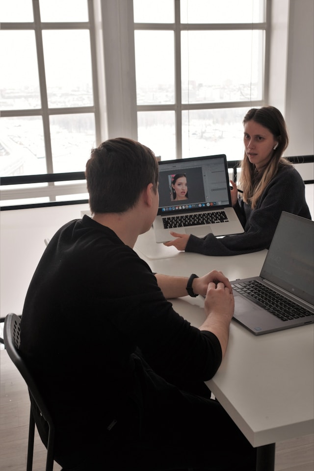 corporate professional reviewing resume screen job workspace