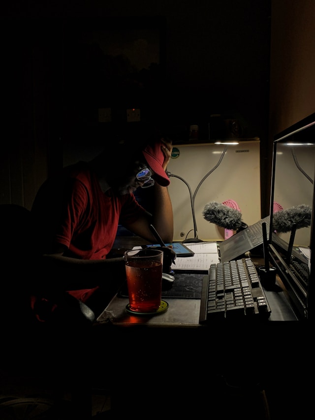 dult studying laptop home night