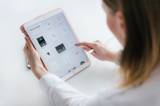 orporate manager reviewing digital resume tablet