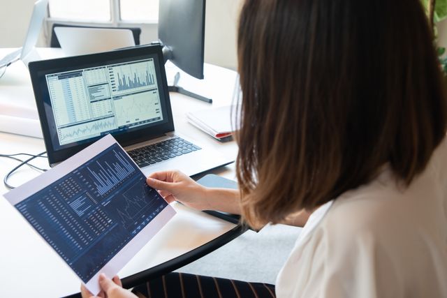 business woman laptop analytics